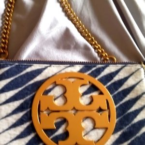 Tory Burch  wristlet. The chain can be changed from wristlet to regular.